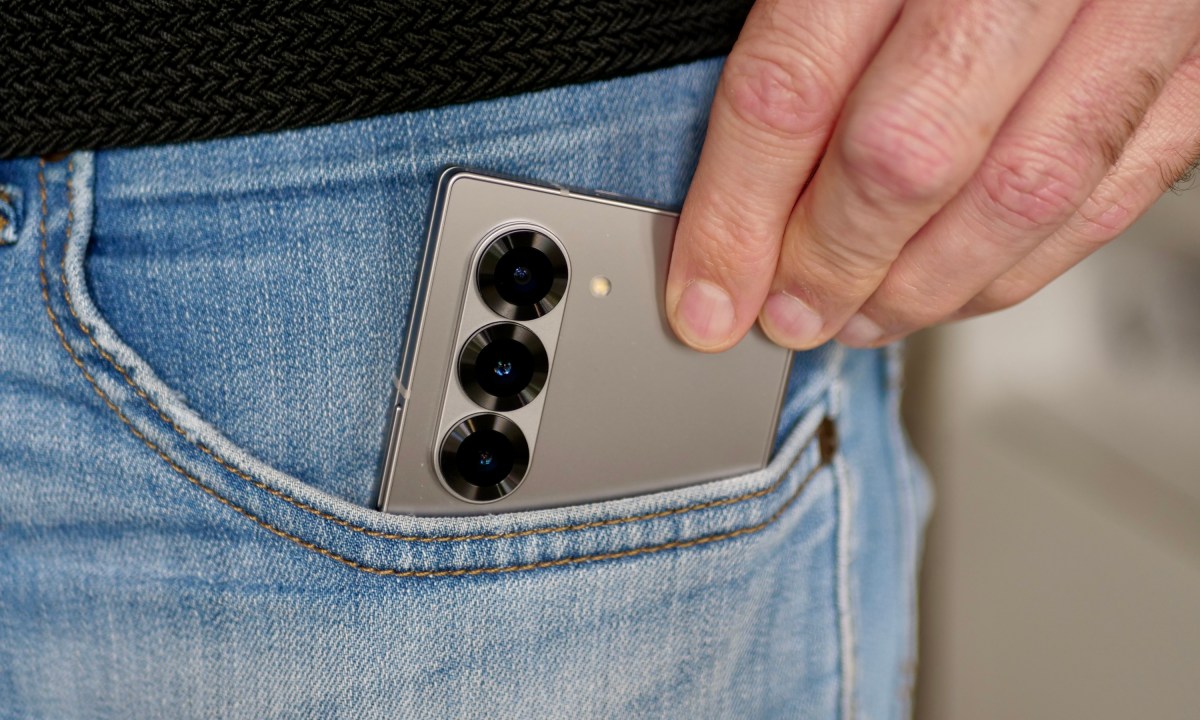 A person taking the Samsung Galaxy Z Fold 6 out of a pocket.