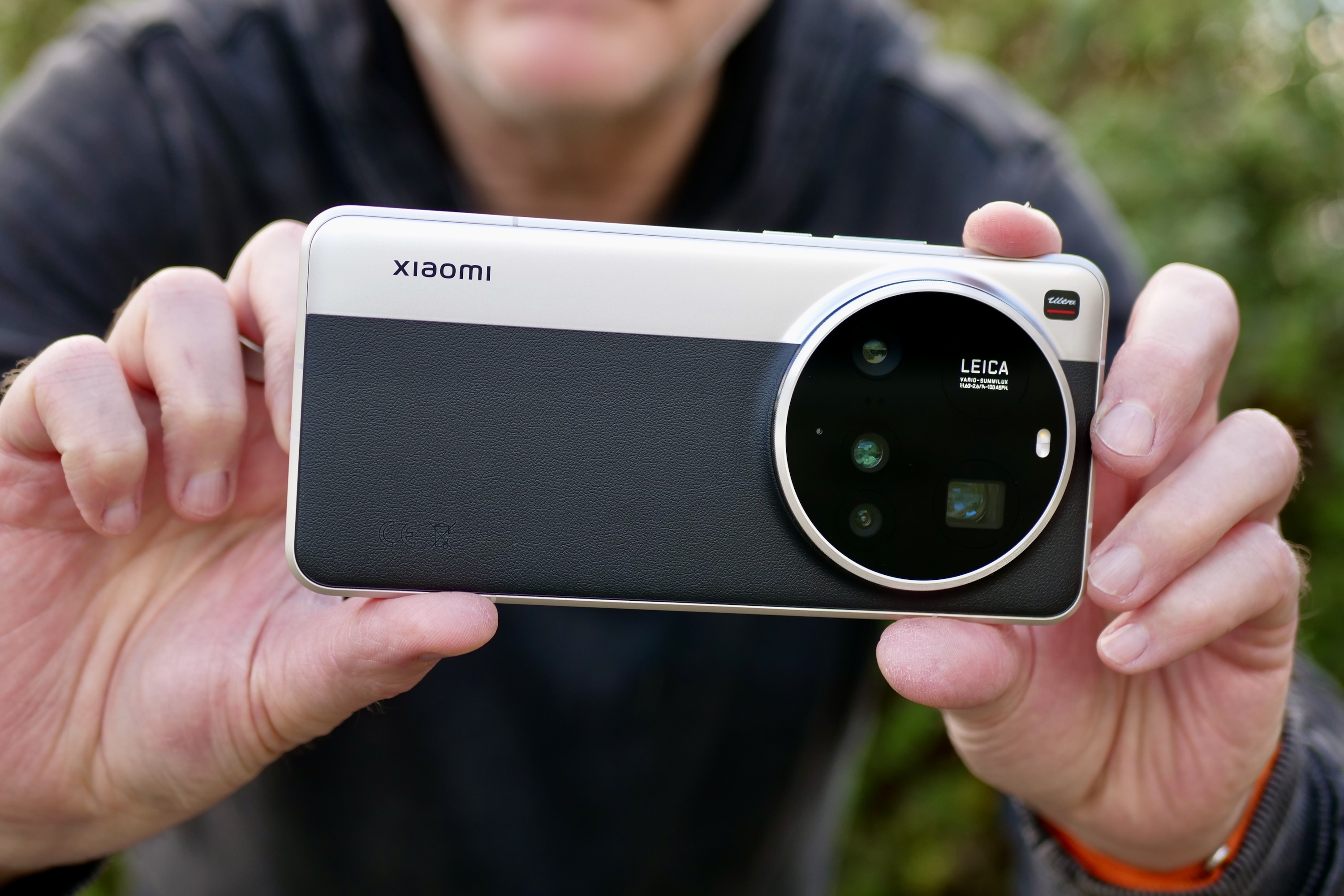 A person taking a photo with the Xiaomi 15 Ultra.